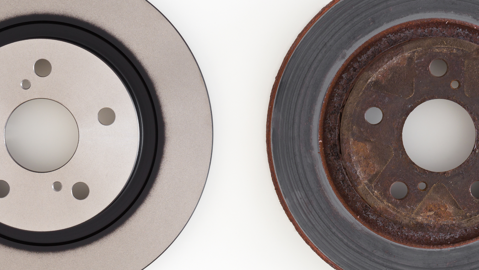 New brake rotor on the left and old worn-out brake caliper on the right