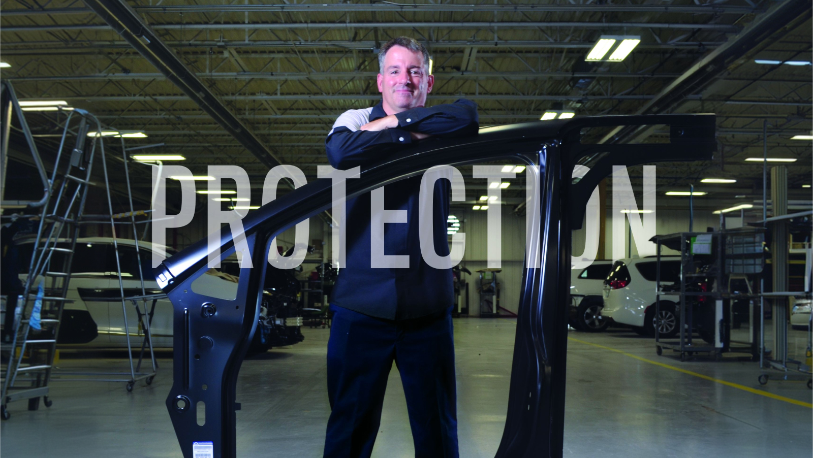 technician standing behind a Mopar body side panel in a collision shop with the word PROTECTION in white over the image